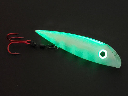 Made for salmon trolling the FishGunn Salmon Plug 'WhiteWasp' glowing from whole body with just spine and eye charged with UV