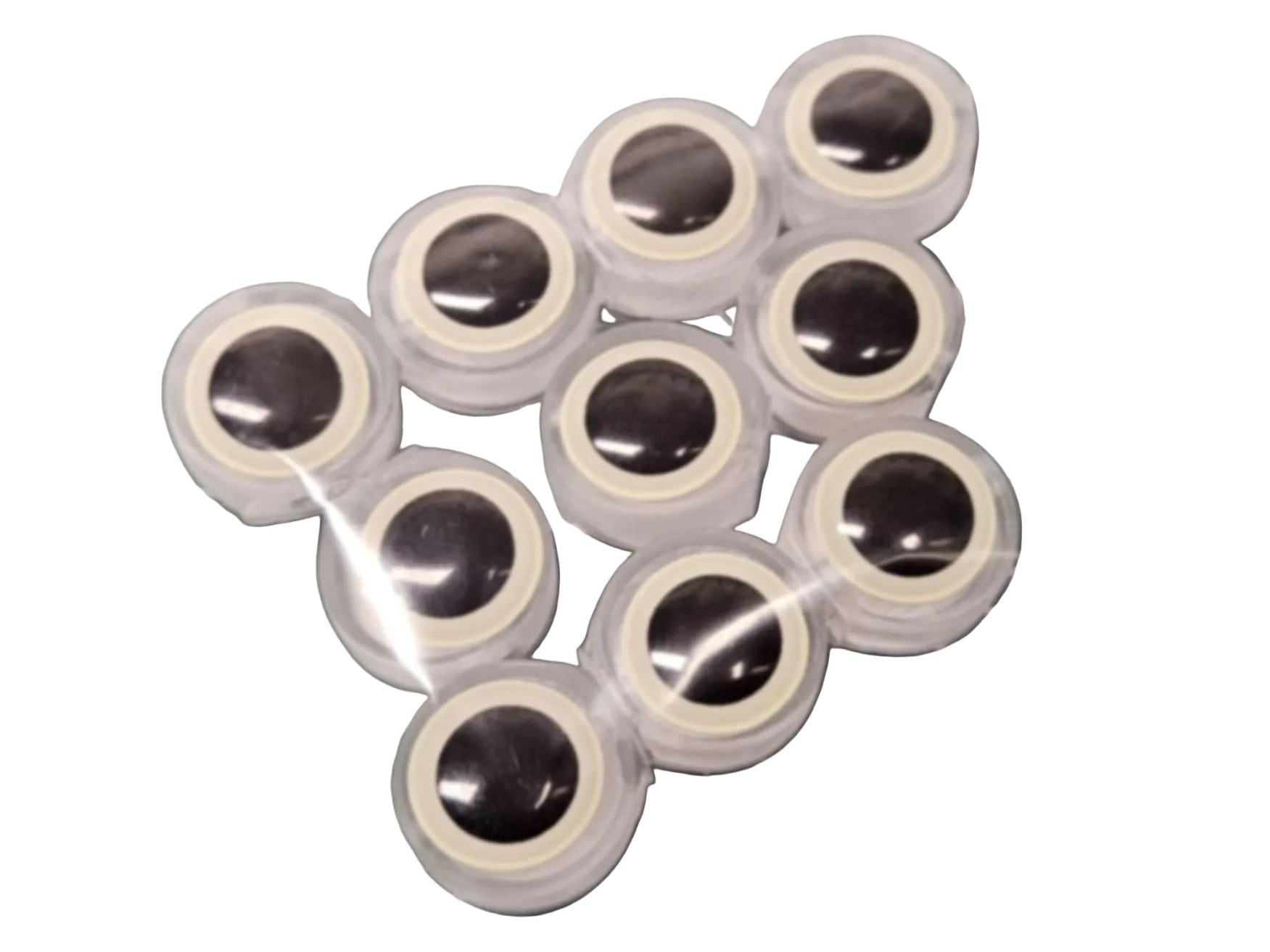10-pack of BigEye Trolling Fly Beads for salmon and trout. Feature large glow eyes, translucent UV resin body, and line thru-hole shown on a green work mat.