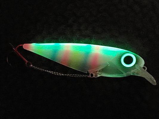 FlatFin Minnow 'Tiger Bread' - Fisher Tackle Company.  Glowing in dark with bright spine and eye filtering thru clear body accented with pink, yellow and blue stripes ready for trolling king salmon