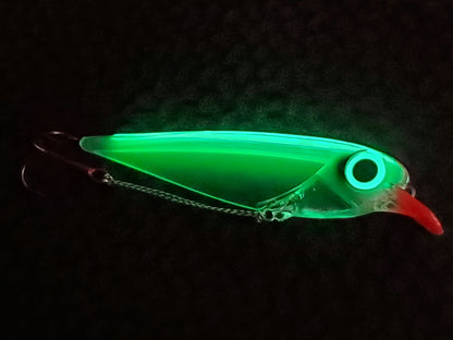Glowing green Flatfin trolling lure on a dark background the body illuminated due to its transperency