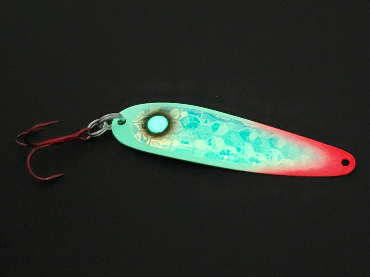 Glowing greenish red tipped Bloody Zombie trolling spoon on black background