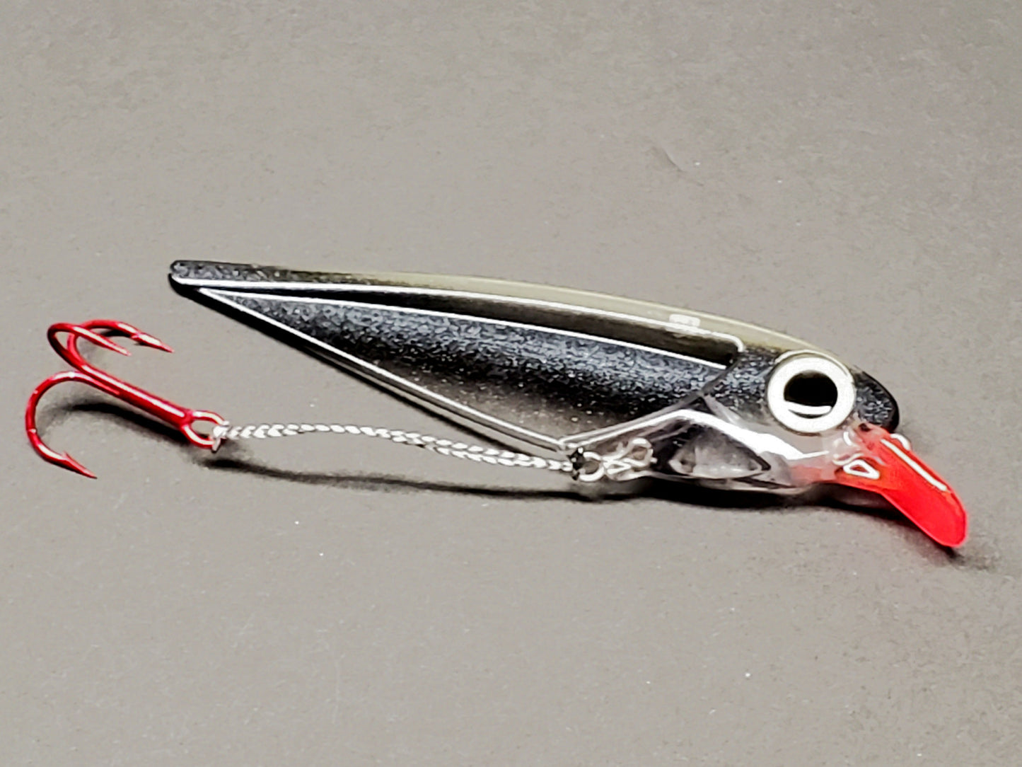 Black Striped FlatFin Trolling Lure with Red Lip and Large Glow Eye in Daylight