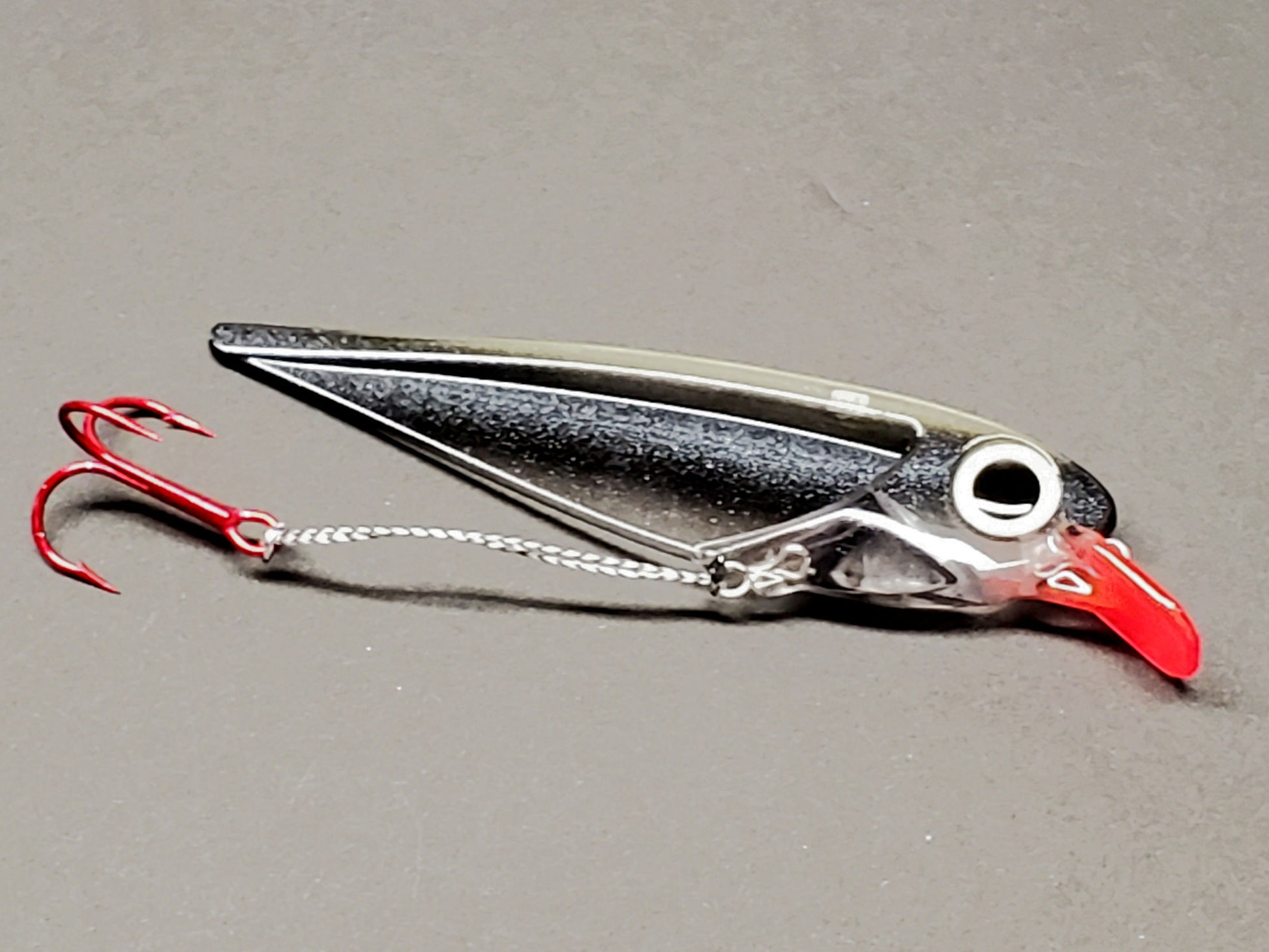 Black Striped FlatFin Trolling Lure with Red Lip and Large Glow Eye in Daylight