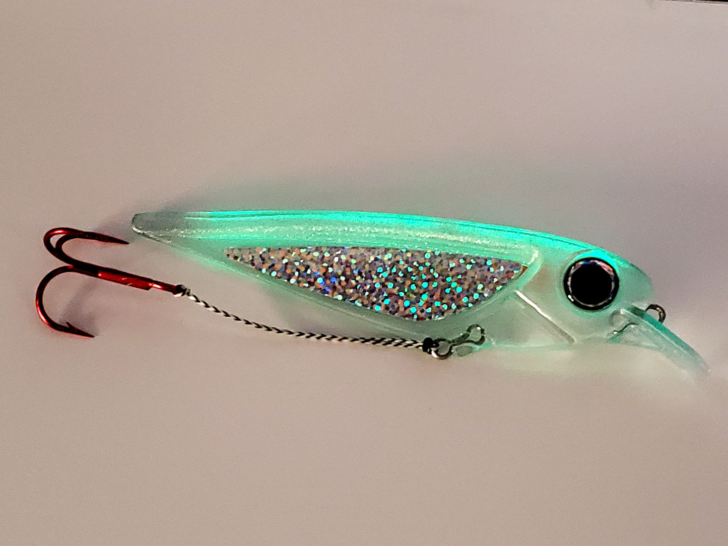 FlatFin 'FlashBang' trolling minnow glowing with holographic sides and huge pearl blue eye