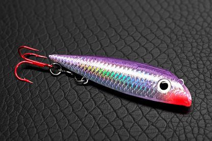 Purple Salmon Plug Lure on Dark Leather Background