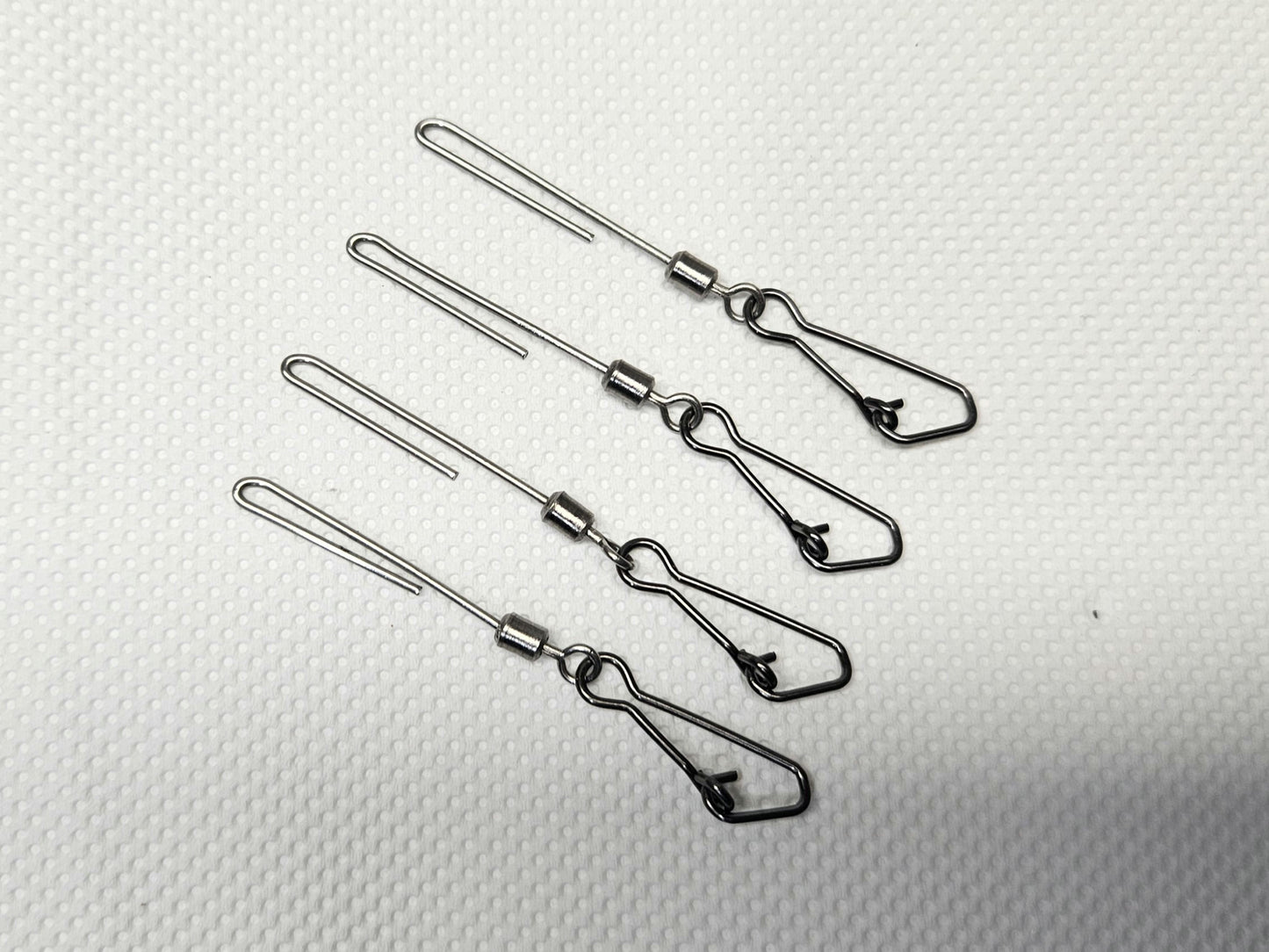 4-pack of stainless steel cannonball sinker hangers for salmon trolling, featuring a low-profile, low-drag design