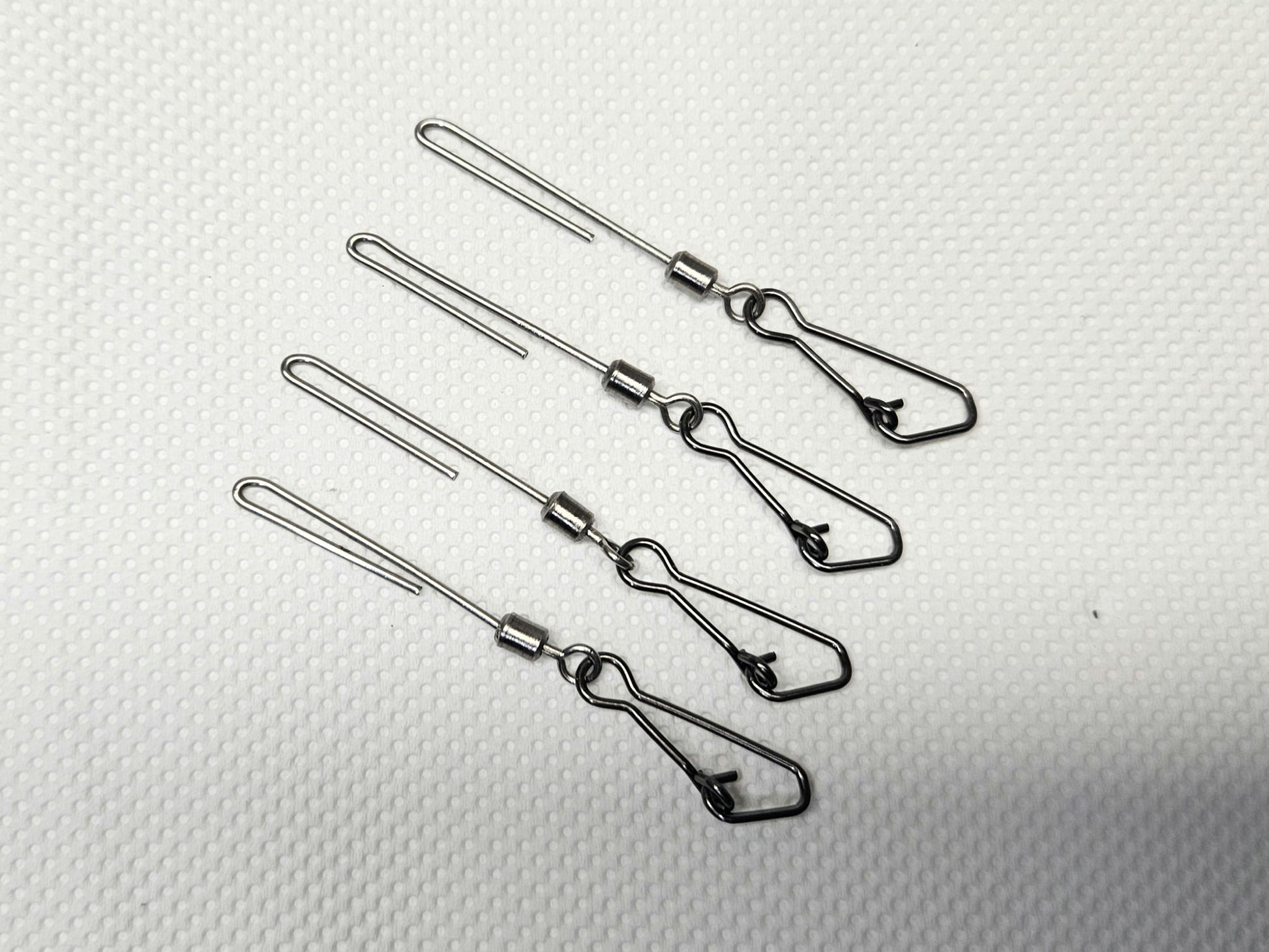 4-pack of stainless steel cannonball sinker hangers for salmon trolling, featuring a low-profile, low-drag design