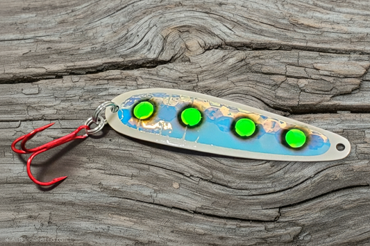 Green Eyes spoon on weathered wood background