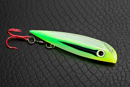 Green Lure on Black Leather Background