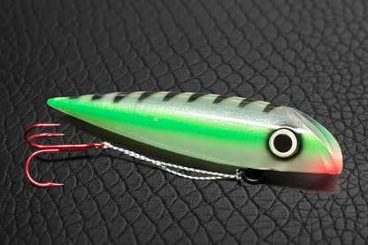 Green striped spoon on black scales