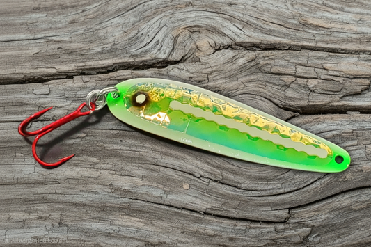 Green Zit Ripper spoon on weathered wood background