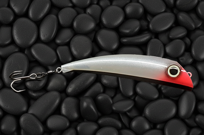 BubbleDart Long CutThroat on black pebbles