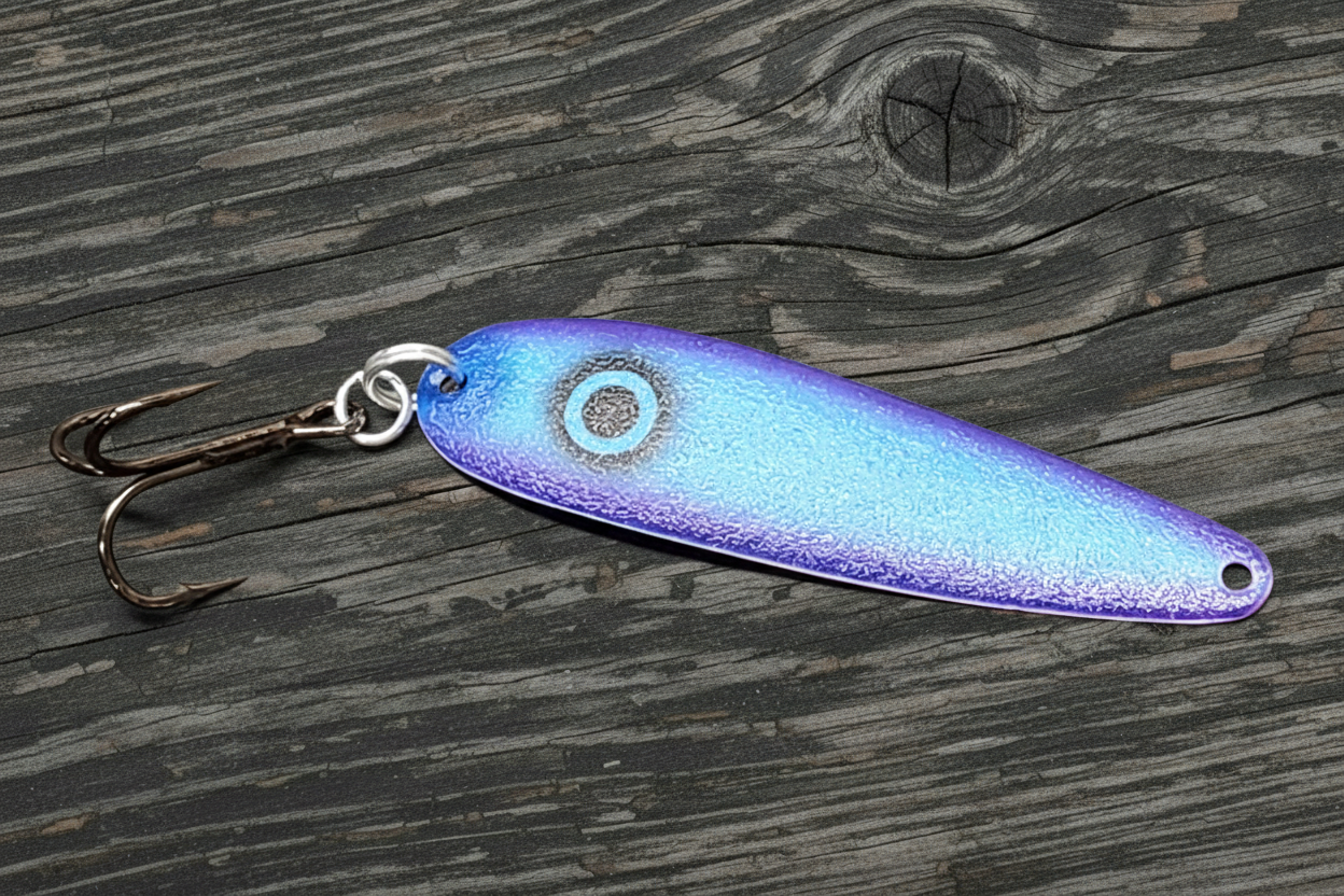 Fisher Tackle UltraMega Glow 'Purple Gunnship' salmon trolling spoon with Blue glow base, a large black eye and purple sides in daylight