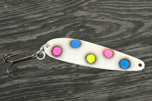 Fisher Tackle UltraMega Glow BlueBread salmon trolling spoon with blue glow base, fluorescent blue, pink, and yellow dots fringed in black in daylight