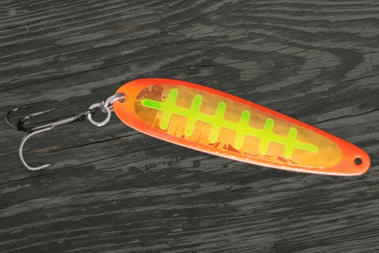 UltraMega Glow 'Fire Toe' Spoon - Fisher Tackle Company  Salmon trolling spoon with Hot Orange glow base and hot red sides with fluorescent yellow holographic ladder in daylight