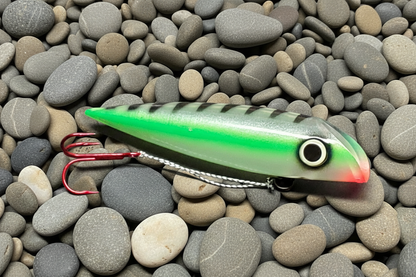 FishGunn Salmon Plug Green Racer on beach pebbles