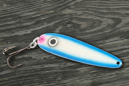 Fisher Tackle UltraMega Glow 'Blue Gunnship' salmon trolling spoon with Blue glow base, a large black eye and blue sides in daylight