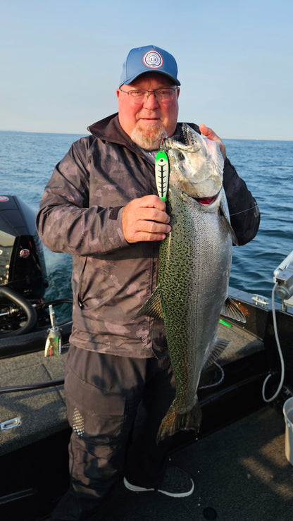 Glow 'Kevins Carbon' Trolling Spoon hanging from big salmons mouth in boat held by man with hat