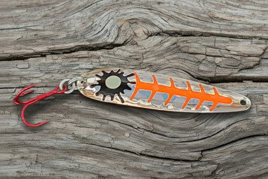Orange Sploosh spoon on weathered wood background