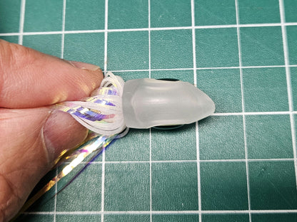 Top view of a Floating Squid Fly head, highlighting the offset nose designed to create a random swimming action while trolling.
