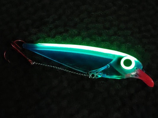 FlatFin Minnow 'Blue Racer' - salmon trolling lure glowing in the dark with blueish body lit-up from glow spine and eye and a bright red lip
