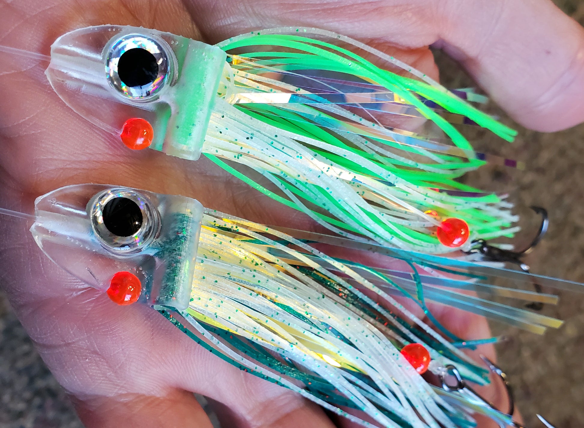 green FlatHead Trolling Flies - 2pcs in palm of hand