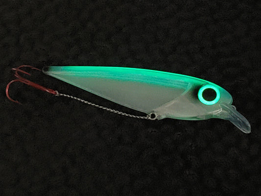 Fisher Tackle FlatFin Minnow 'Real Deal Blue' shown with unique spine and eye glowing in dark illuminating the translucent lure body