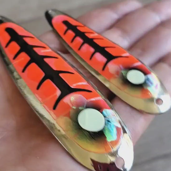 Video of MAGMA orange and red holographic with black accents salmon trolling spoons