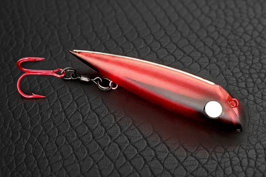 MR POOL FishGunn salmon trolling plug by Fisher Tackle in daylight showing cool blood-red satin finish with flat black accents and large pupil-less glow eye and hook on roller swivel for decoupling