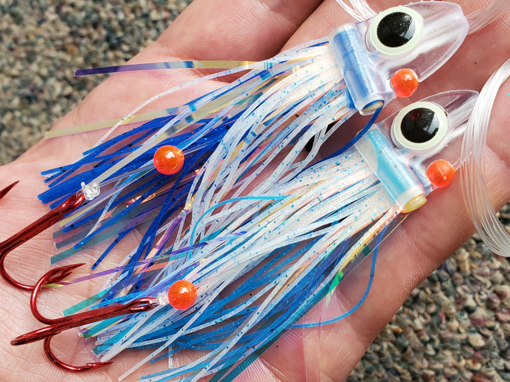 Blue FlatHead Trolling Flies - 2pcs - in palm of hand Fisher Tackle Company