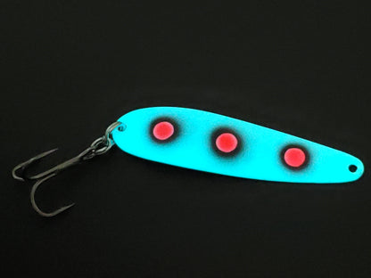 Fisher Tackle UltraMega Glow 'RedEyes' salmon trolling spoon with teal glow base and 3 large fluorescent red dots fringed in black glowing in dark