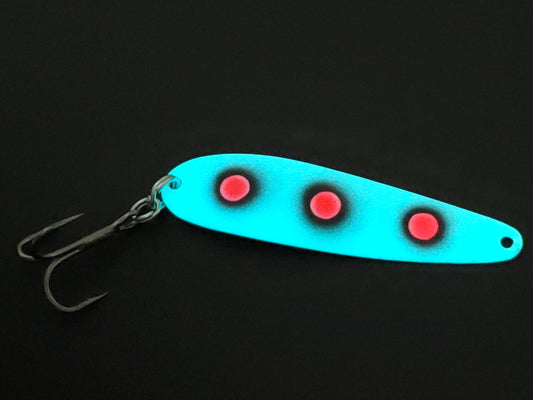 Fisher Tackle UltraMega Glow 'RedEyes' salmon trolling spoon with teal glow base and 3 large fluorescent red dots fringed in black glowing in dark