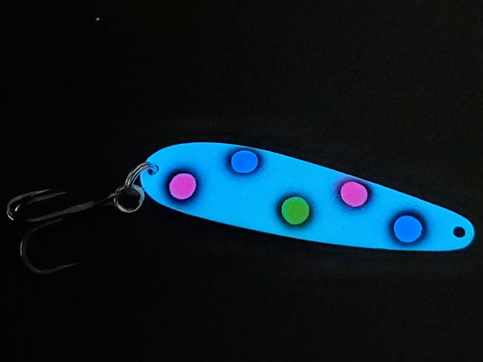 Fisher Tackle UltraMega Glow BlueBread salmon trolling spoon with blue glow base, fluorescent blue, pink, and yellow dots fringed in black glowing in dark