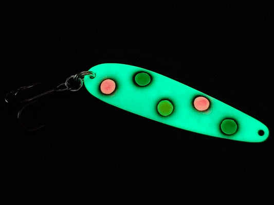 Fisher Tackle UltraMega Glow GreenBread salmon trolling spoon with green glow base, green, pink and yellow spots fringed in black glowing in dark