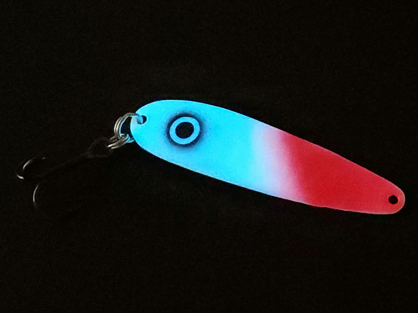 UltraMega Glow 'Bloody Guppy' Spoon - Fisher Tackle Company.  Salmon trolling spoon with Blue glow base and hot red tip and a large black eye glowing in the dark