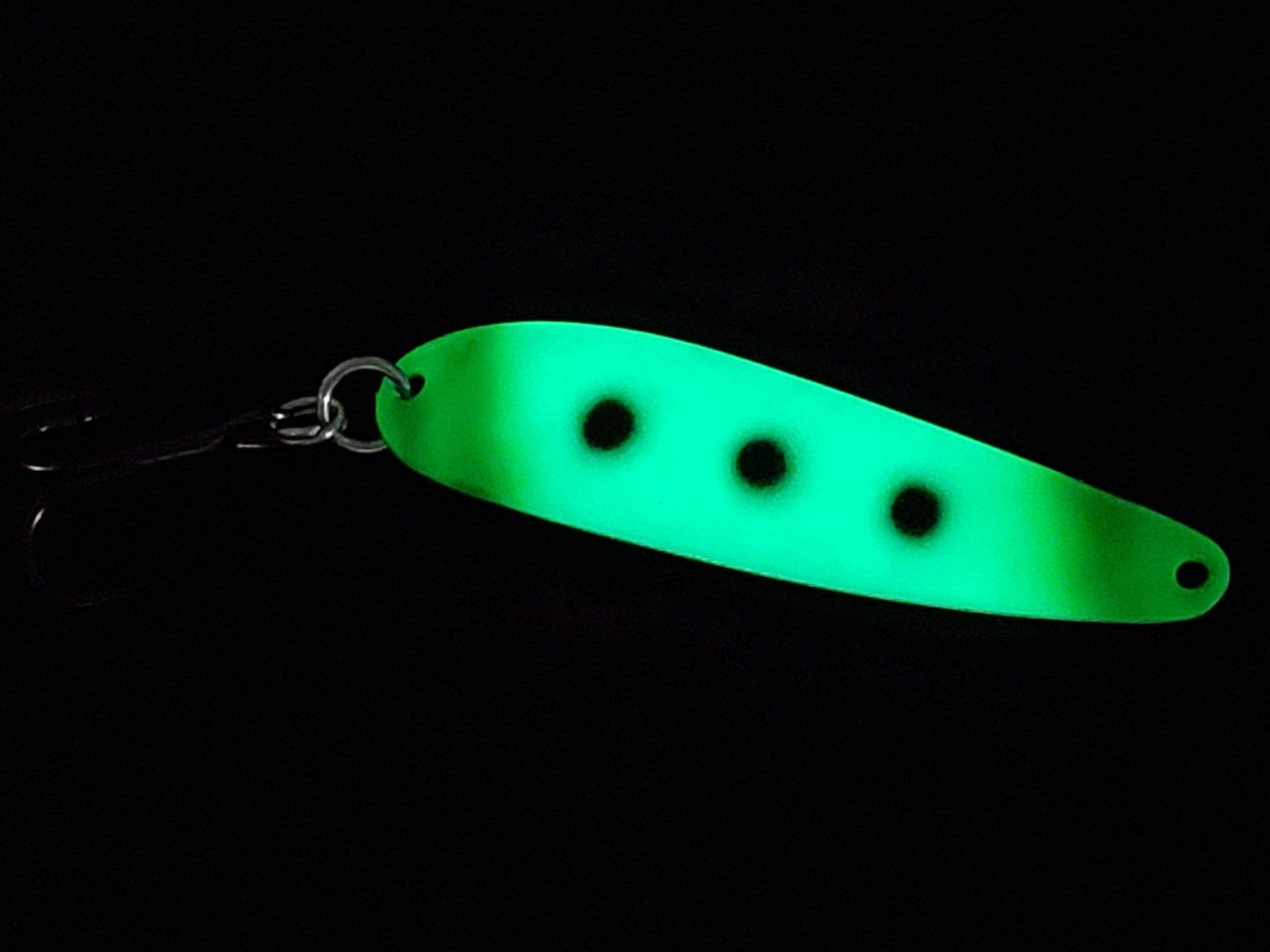Fisher Tackle UltraMega Glow Green Scooter salmon trolling spoon with green glow base, green tips and 3 black spots glowing in dark