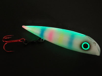 Trolling lure FishGunn Salmon Plug 'Tizzy Fit' glowing in dark showing lures pearlescent white glitter sides, large glow eye with pink/blue/yellow tiger stripes showing thru