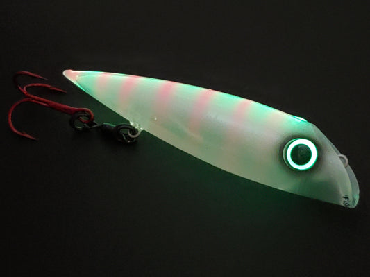 FishGunn Salmon Plug 'Tizzy Fit' glowing in dark with pink ladder back showing thru the glow and large glow eye with contrasting black pupil